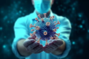 A healthcare worker presenting a large, detailed model of a virus