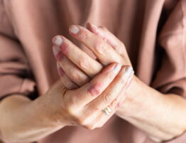 Elderly hands clasped together